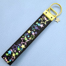 Load image into Gallery viewer, Stars on Black with Glitter on Gold Key Chain Fob with Enameled Star cmCharm
