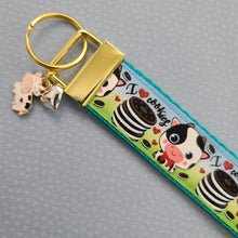 Load image into Gallery viewer, Cows with Glitter I Love Cookies Gold Key Chain Fob with Enameled Flower Charm
