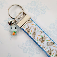 Load image into Gallery viewer, Bunnies with Carrots on White Key Fob Wristlet on Silver or Rainbow
