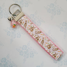 Load image into Gallery viewer, Bunnies with Carrots on White Key Fob Wristlet on Silver or Rainbow
