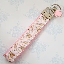 Load image into Gallery viewer, Bunnies with Carrots on White Key Fob Wristlet on Silver or Rainbow

