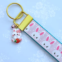 Load image into Gallery viewer, Bunnies with Glittery Faces on Pink Key Chain Fob with Yellow Gold Clasp and Cute Enameled Bunny Charm
