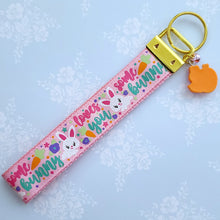 Load image into Gallery viewer, Some Bunny Loves You with Glitter Flowers &amp; Carrots on Gold Key Chain Fob includes Enameled Bunny Charm
