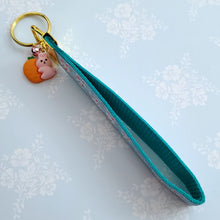 Load image into Gallery viewer, Bunnies with Carrots &amp; Flowers on Light Blue Yellow Gold Key Chain Fob with Enameled Bunny Charm
