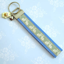 Load image into Gallery viewer, Bunnies In Love on Blue Keychain Fob with Cute Bunny Charm
