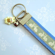 Load image into Gallery viewer, Bunnies In Love on Blue Keychain Fob with Cute Bunny Charm
