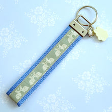 Load image into Gallery viewer, Bunnies In Love on Blue Keychain Fob with Cute Bunny Charm
