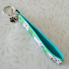 Load image into Gallery viewer, White Puppies Key Chain Fob with Enameled Paw Print Charm
