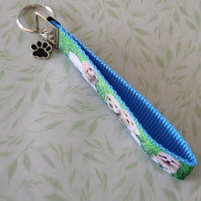 Load image into Gallery viewer, White Puppies Key Chain Fob with Enameled Paw Print Charm
