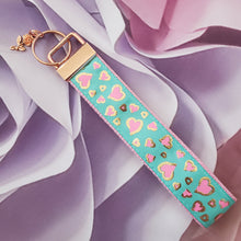 Load image into Gallery viewer, Hearts in Pink on Gold Foil Outline Key Chain Fob on Rose Gold with Rose Charm
